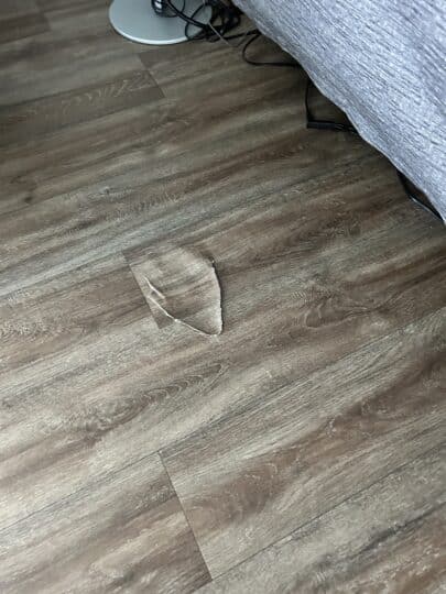 2023-08-14-squeaky-damaged-vinyl-flooring-repair-cincinnati-ohio-before